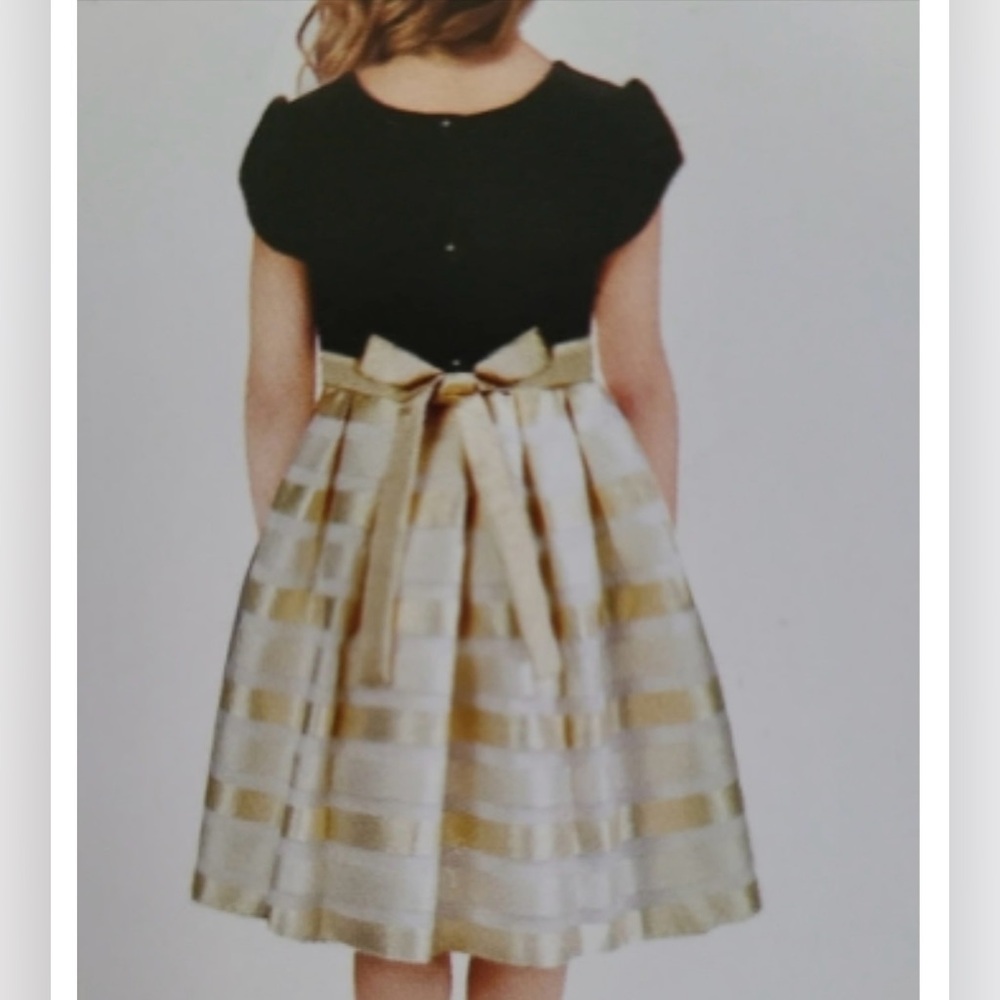 Jona Michelle Black, Ivory & Gold Dress with Bow Accent
Size: (7) - Picture 3 of 13